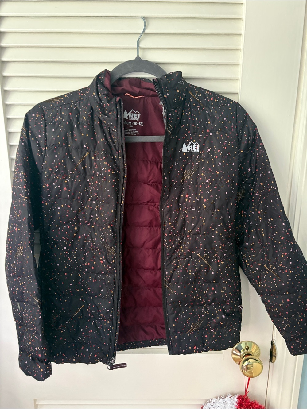 REI Black Puffer Jacket with Maroon Interior and Multicolor Speckle